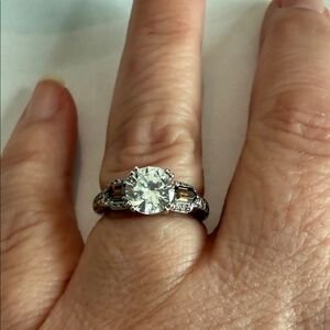 Sterling Silver Ring with chocolate stones on either side of diamonique. Size 6